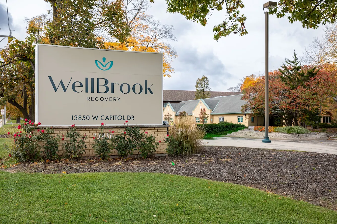 WellBrook Recovery sign beside landscaped facility entrance