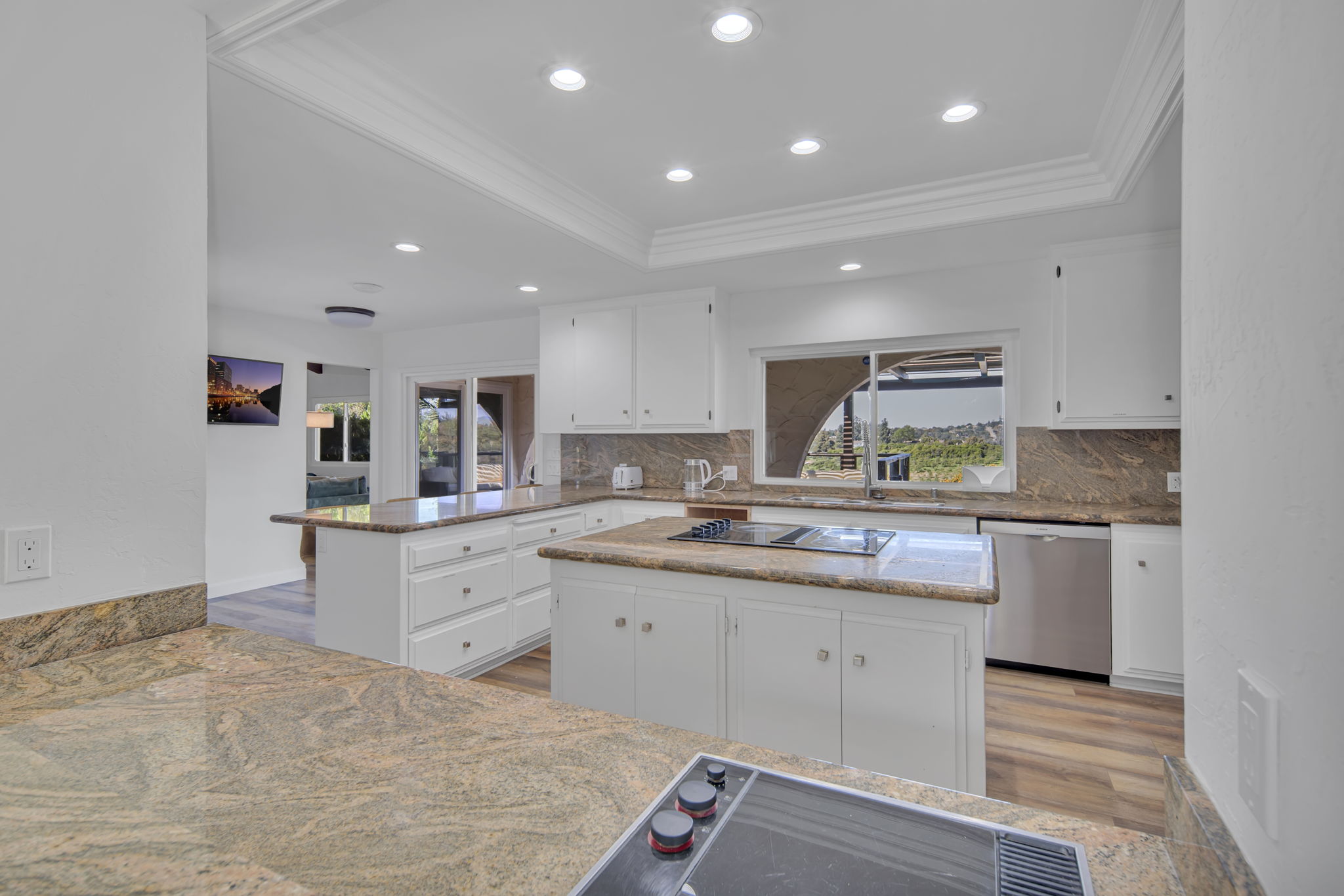 Clean, modern kitchen with marble counters