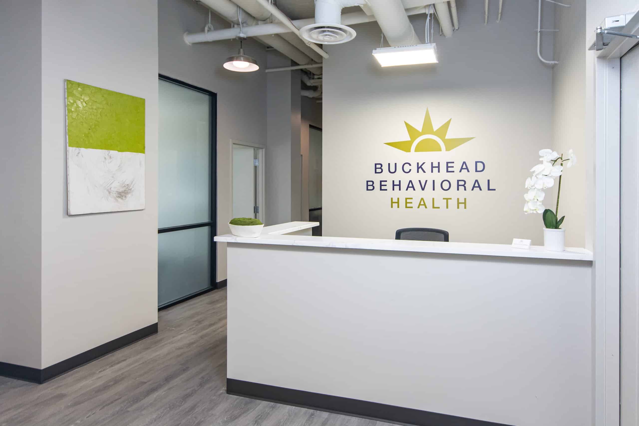 A reception desk at Buckhead Behavioral Health with modern decor.