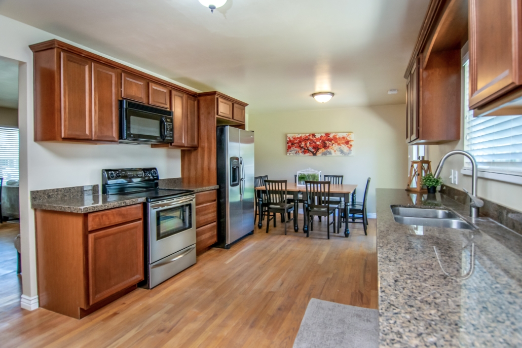 Shared kitchen with appliances and dining space