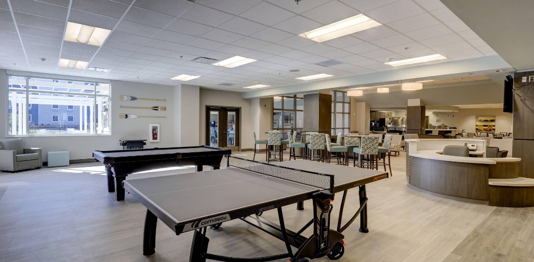 Recreation lounge with ping pong, pool table, and seating