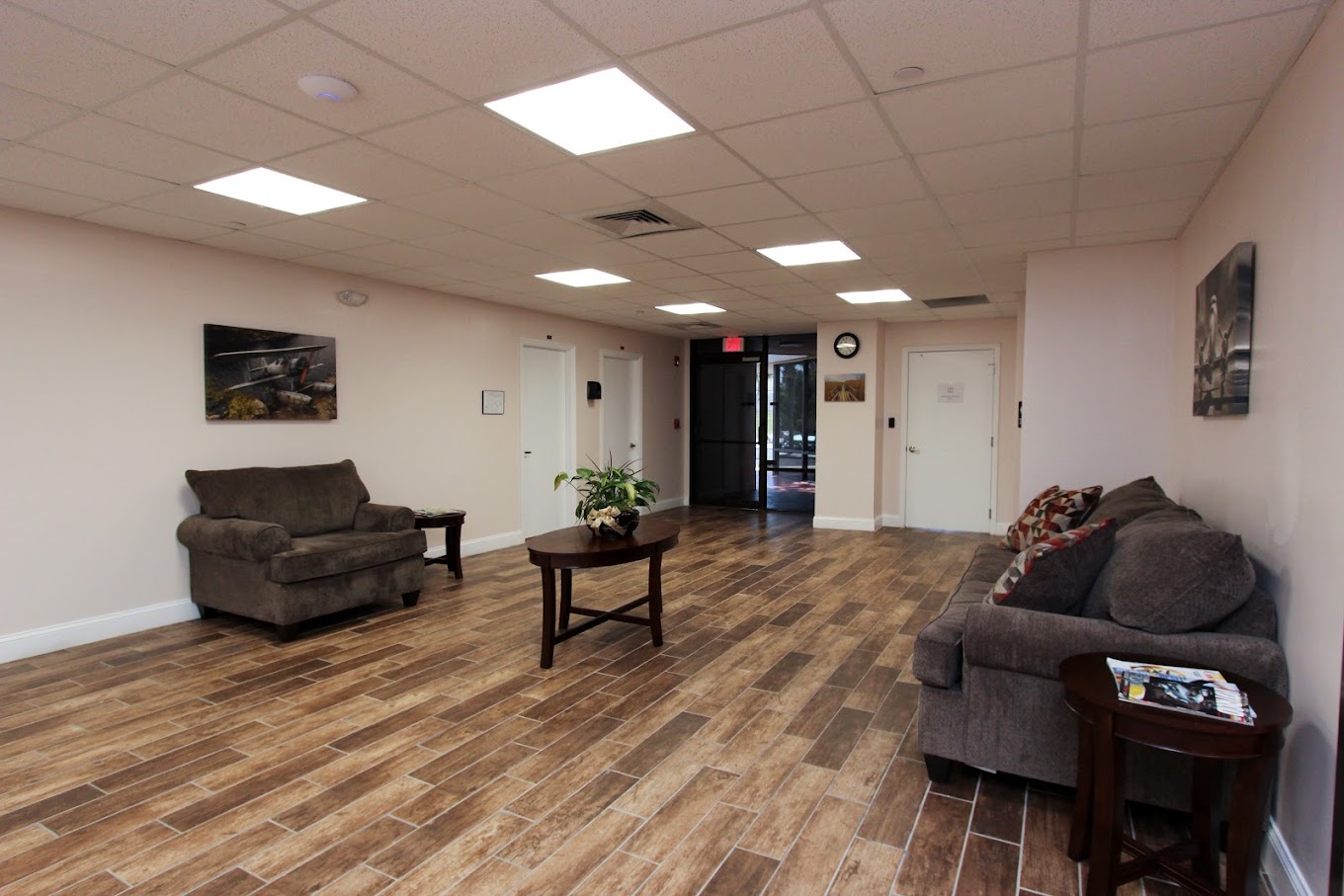Open lobby area with sofas and tables.