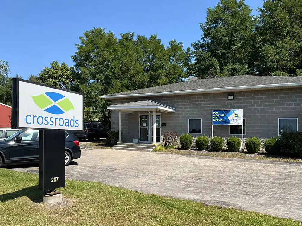 Exterior of clinic building with signage and parking