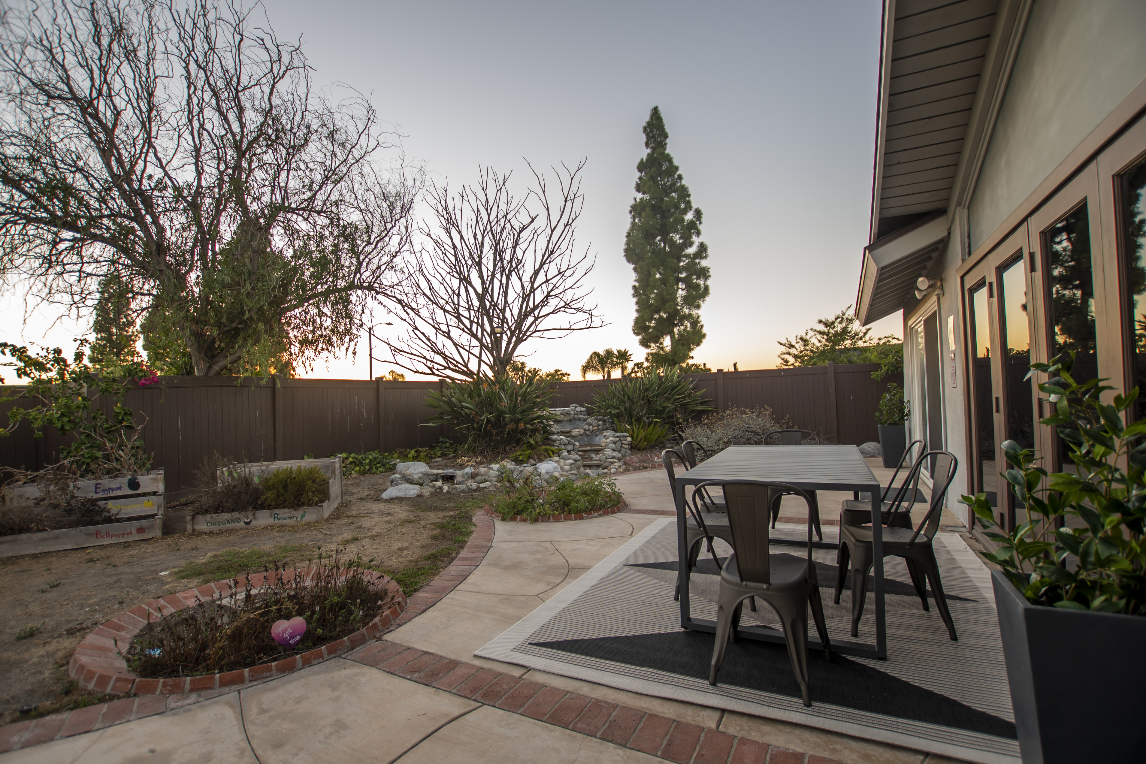 Outdoor patio with dining table and garden view
