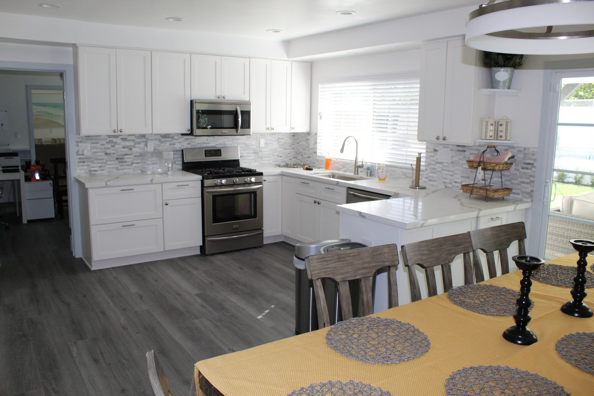 Modern kitchen and dining area with seating for eight