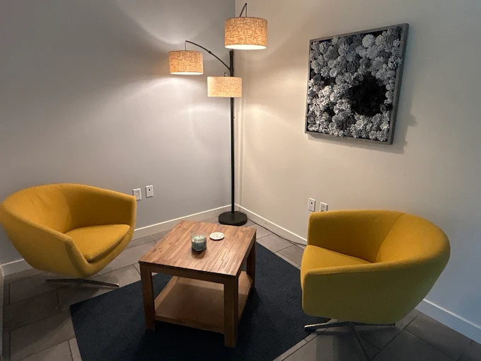 Yellow chairs and wood table with floor lamps