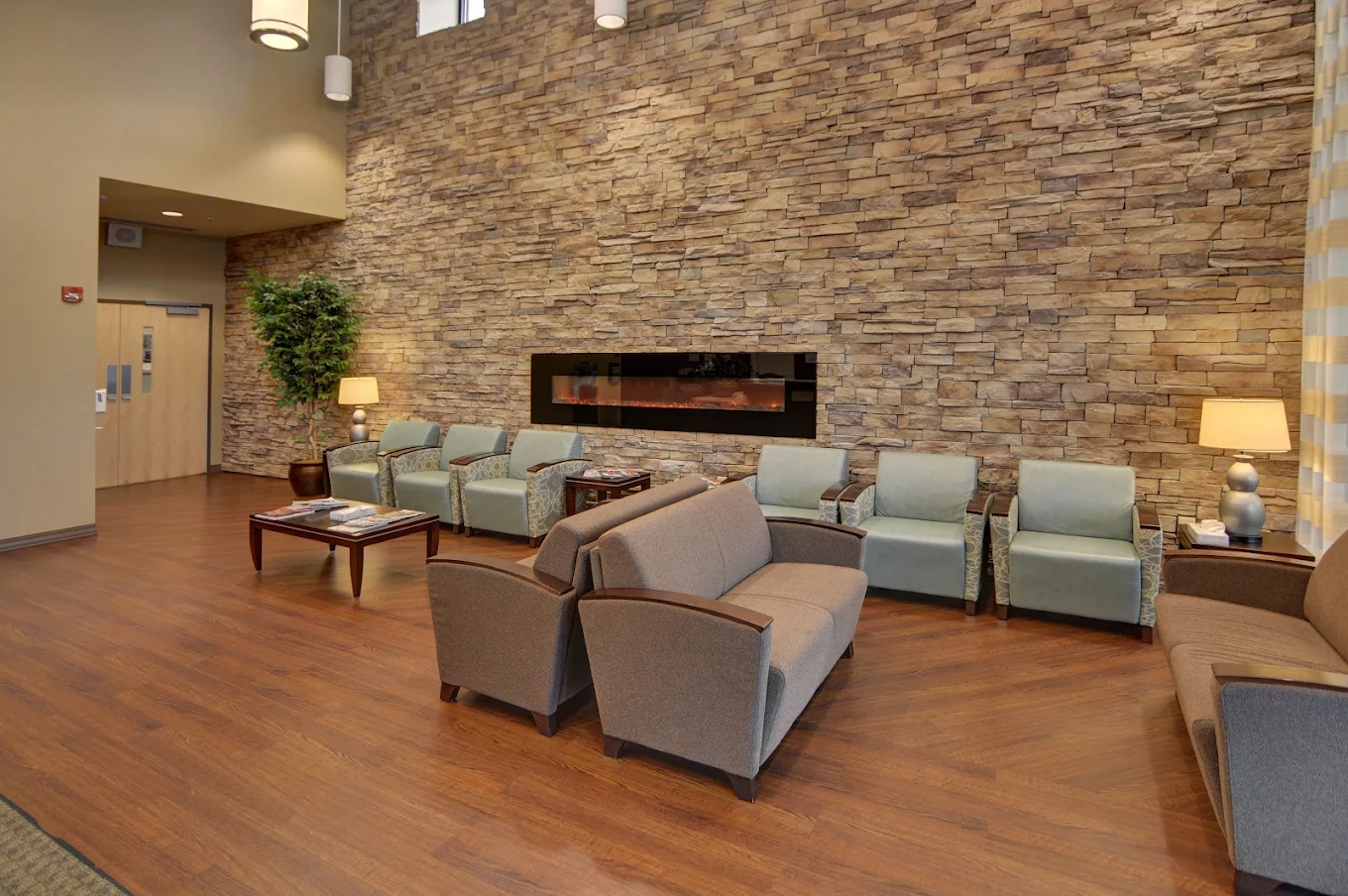 Cozy seating lounge with fireplace and armchairs