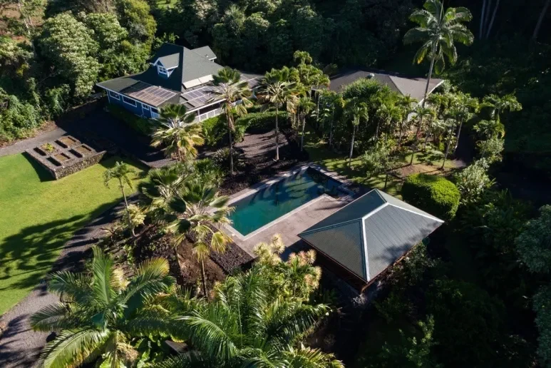 Lush campus with pool and tropical gardens