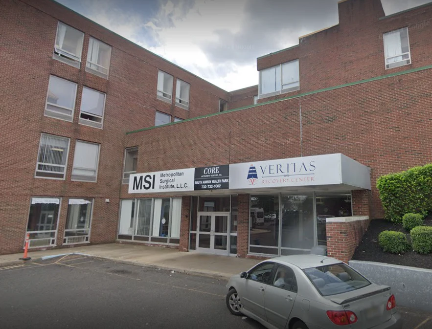 Brick building with Veritas Recovery Center sign and entry