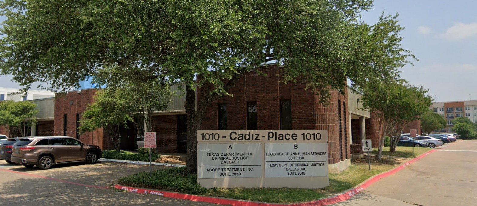 The front entrance of Abode Treatment Inc. in Dallas, with a clear sign and a welcoming environment.