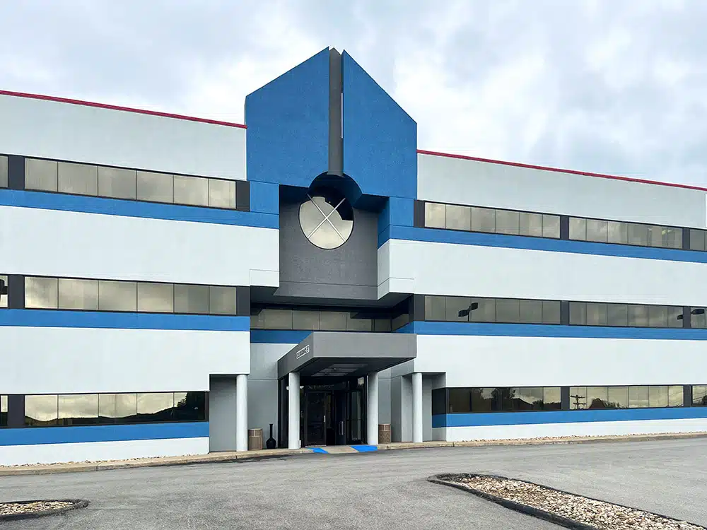 Modern clinic building exterior with blue and white facade