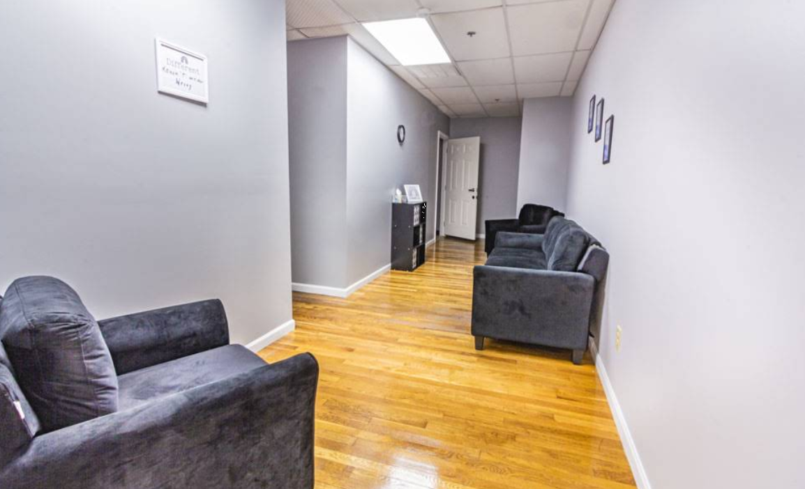Hallway waiting area with chairs and seating along the wall