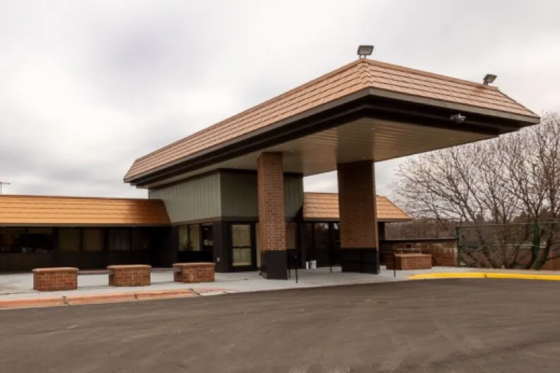 Covered main entrance of Cochran Recovery Program building