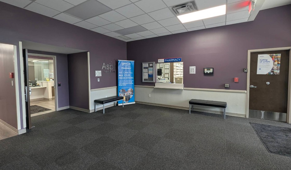 Pharmacy lobby with service window and seating