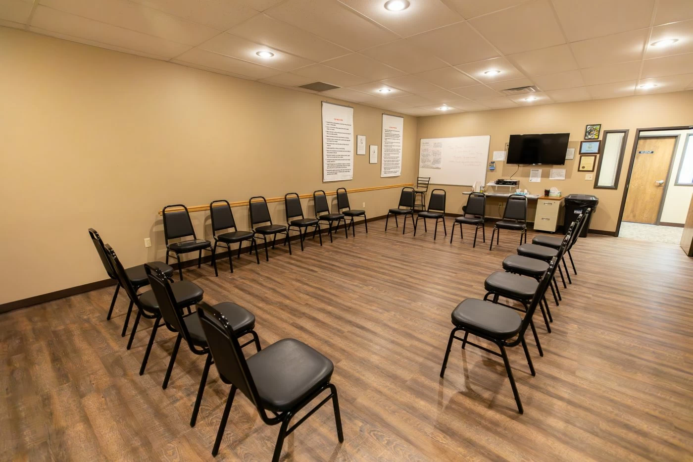 Group therapy room with chairs arranged in a circle inside addiction treatment center