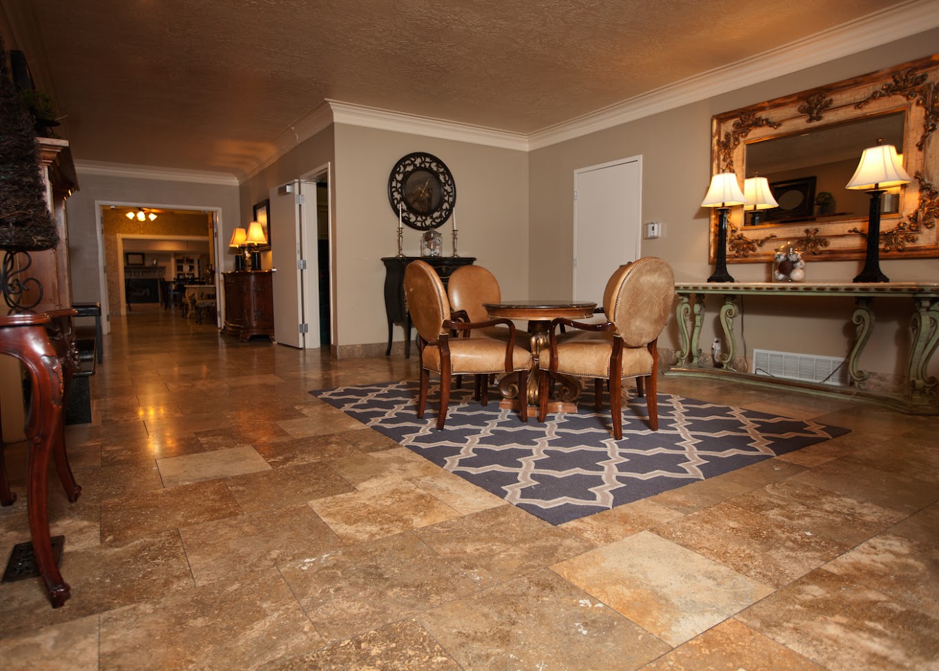 Cozy lobby with seating and decorative mirror