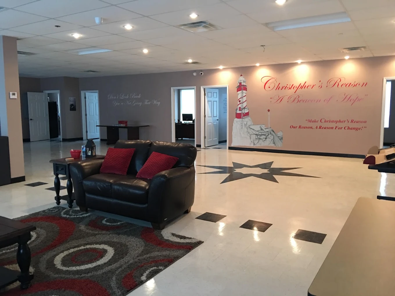 Lounge area with leather sofa and wall art