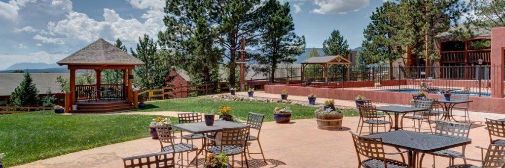 Outdoor patio with a gazebo and seating.