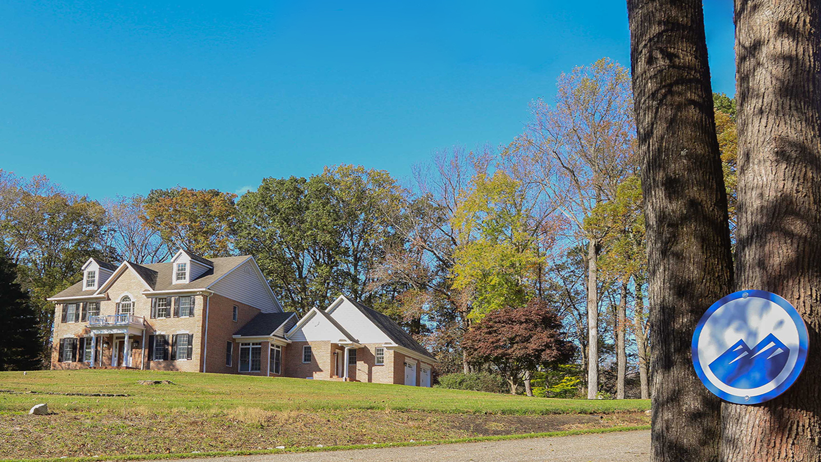 Front exterior of teen treatment center with green lawn