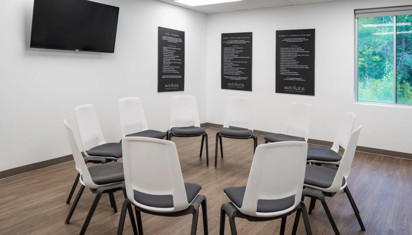 White chairs in therapy circle with motivational posters