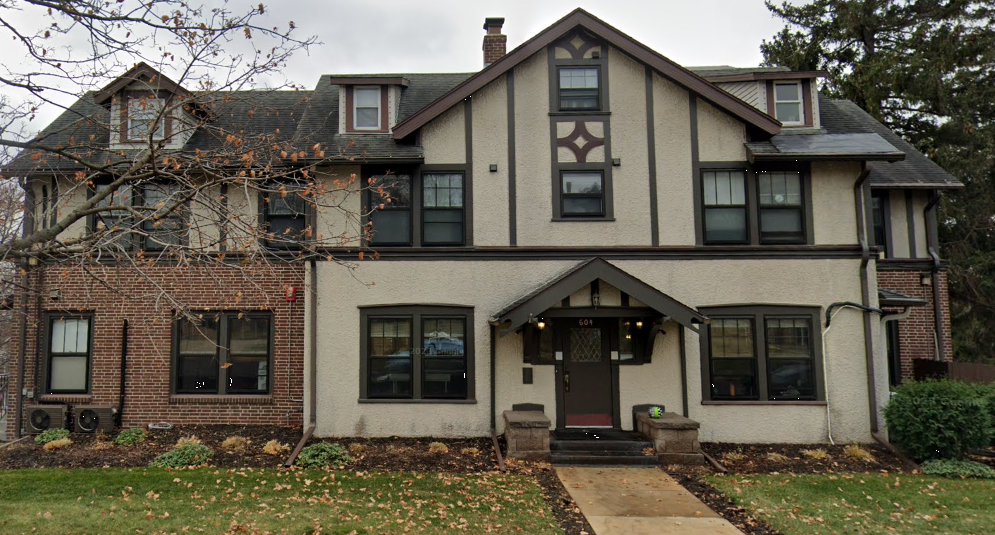 Tudor-style rehab facility exterior with brick and stucco facade