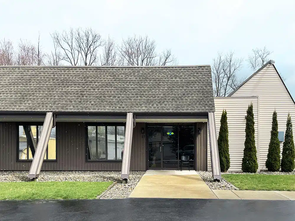 Clinic exterior with sloped roof and front entrance walkway