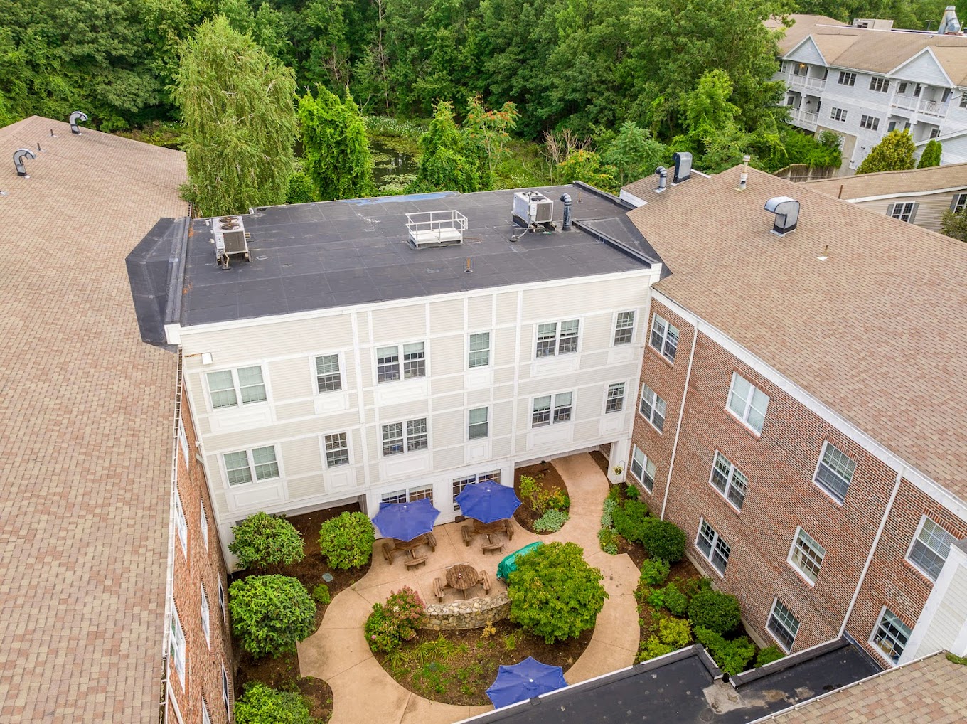  Aerial view facility courtyard with shaded seating.