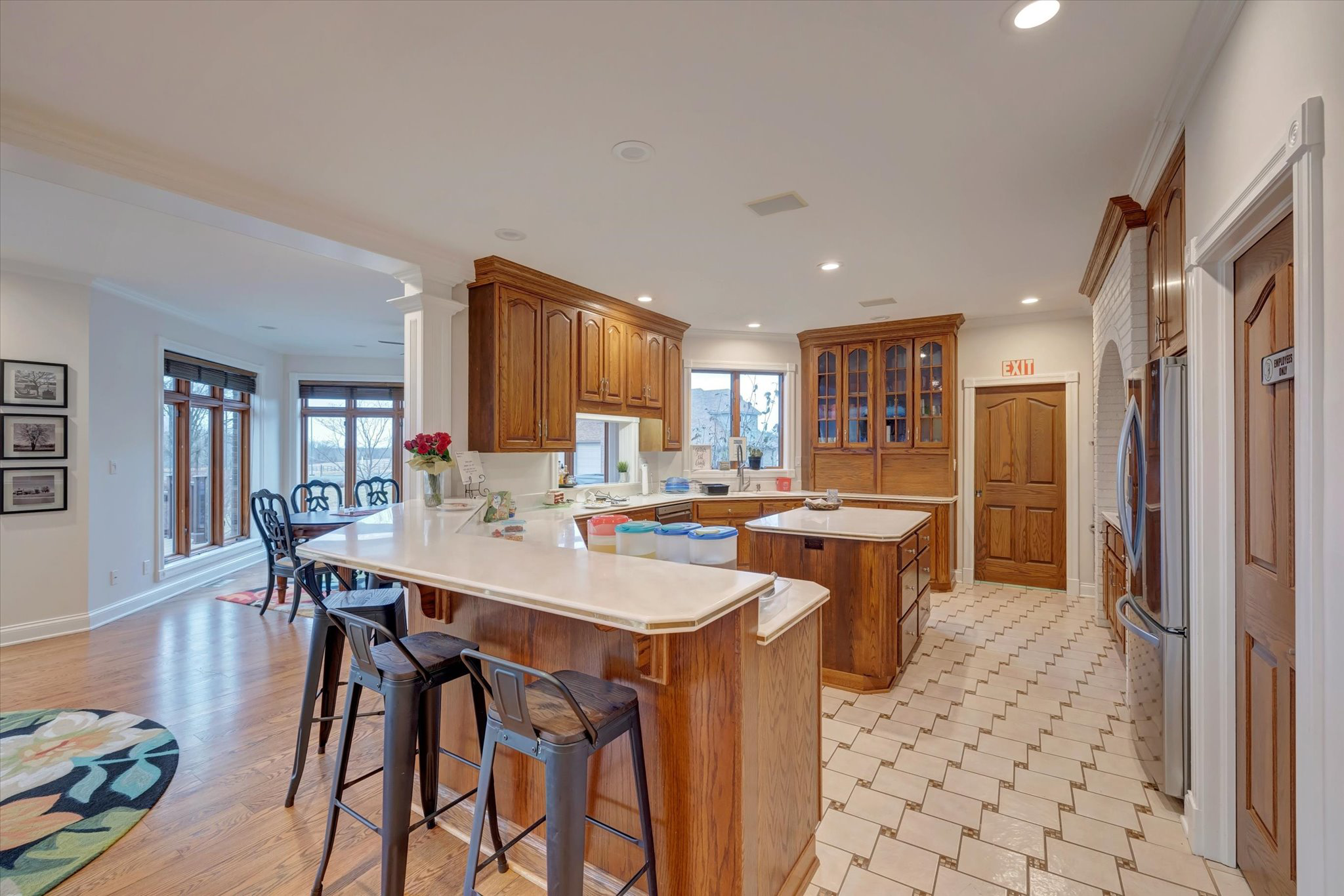 Large communal kitchen with island seating and dining space