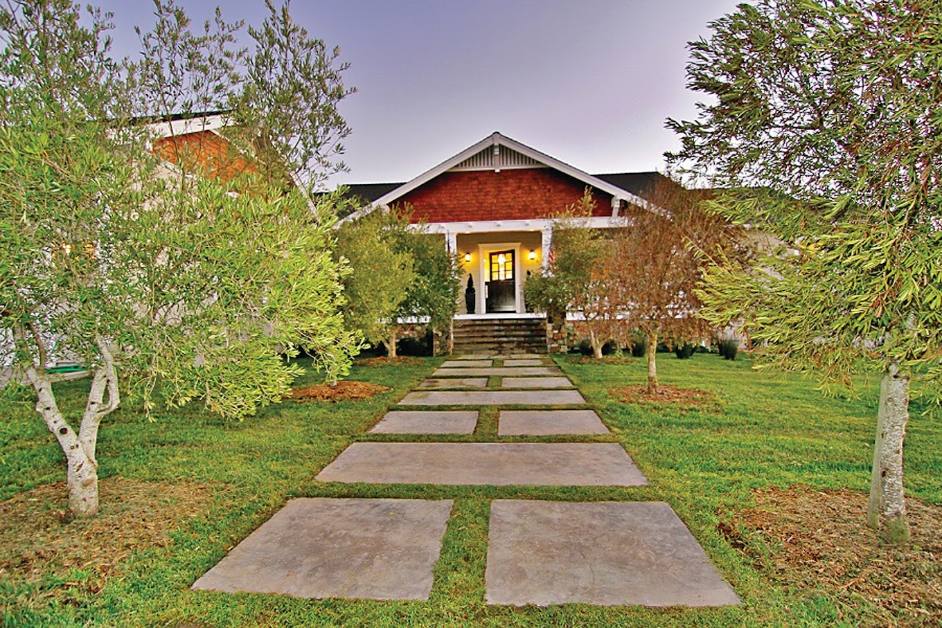 Walkway to facility with trees.