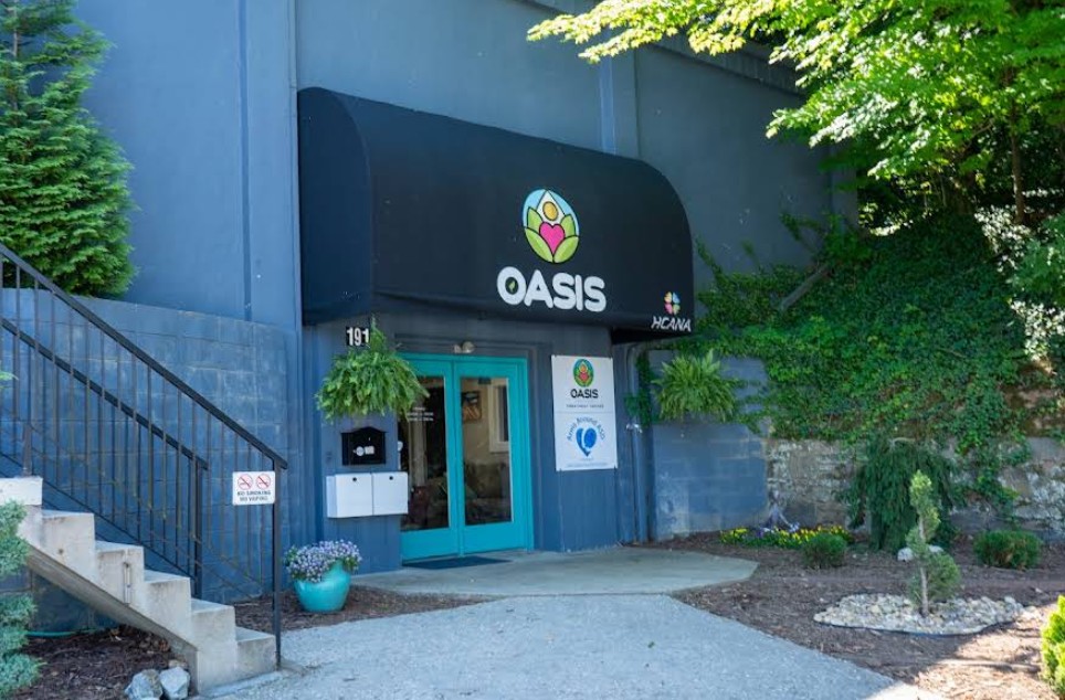 Exterior entrance of Oasis Recovery Center with covered entry and landscaped walkway