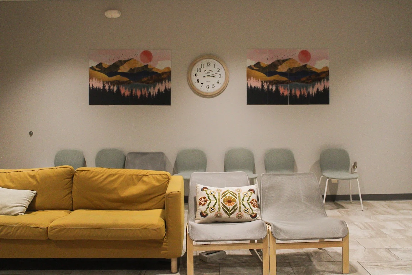 Waiting room with sofa, chairs, and guest seating