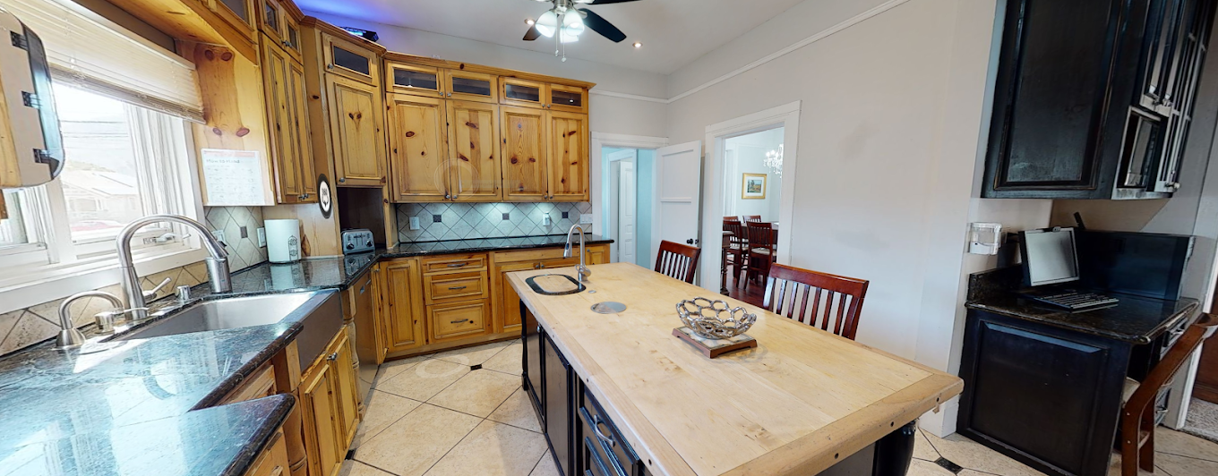 Kitchen with island, wood cabinets, and modern appliances