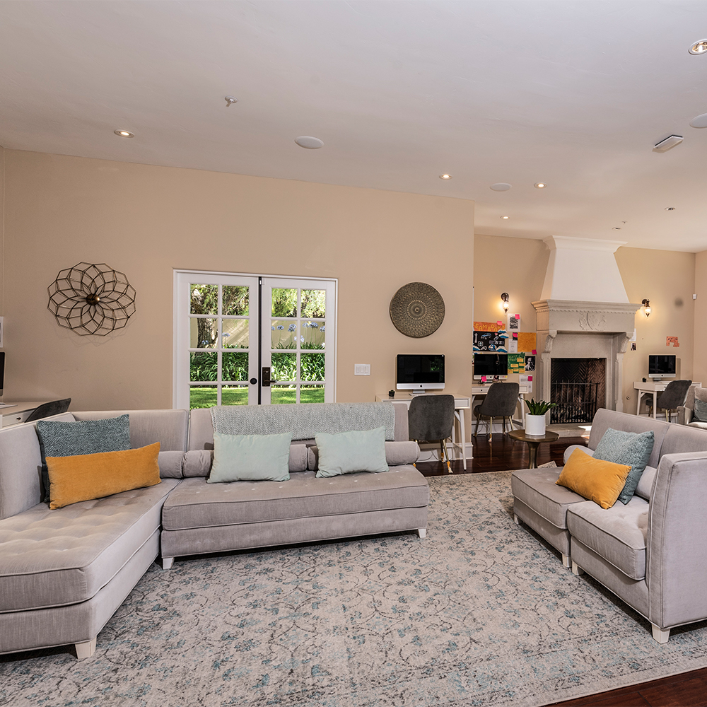 Lounge with seating and fireplace.