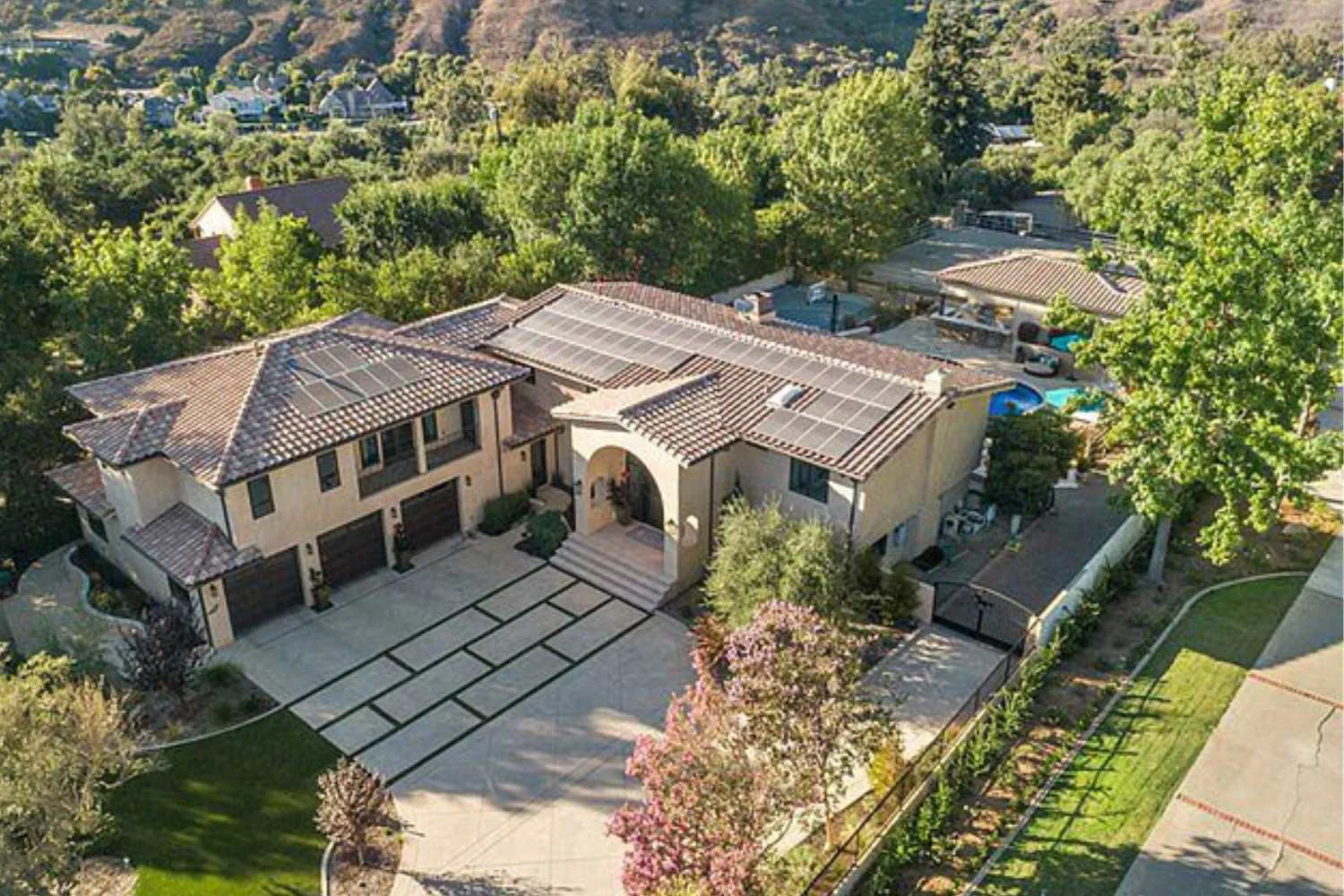 Aerial view of facility with driveway.