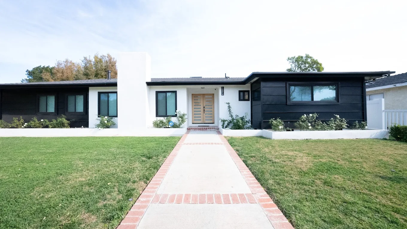 Modern home exterior with walkway and lawn