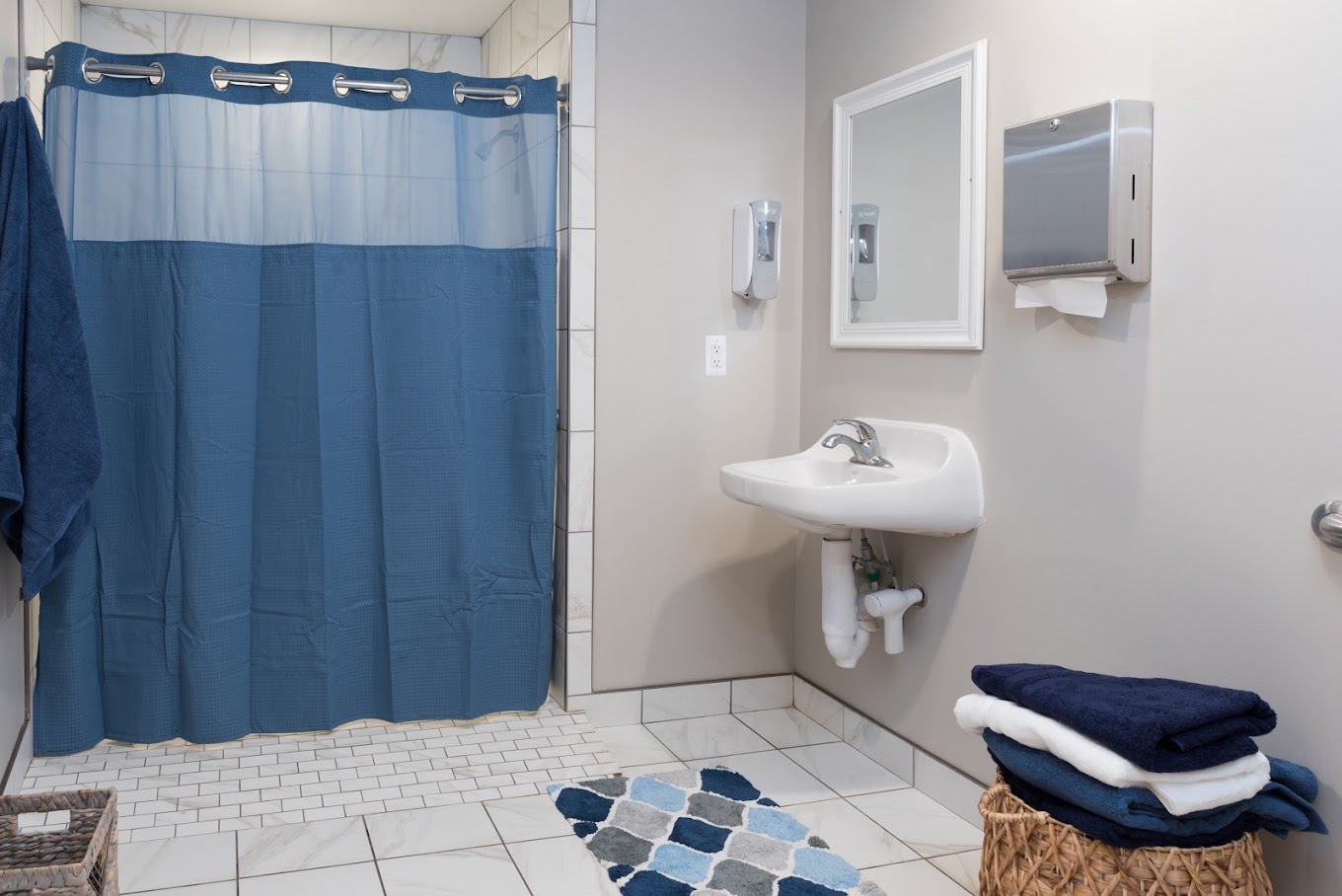 A bright and hygienic bathroom with an easy-access shower.