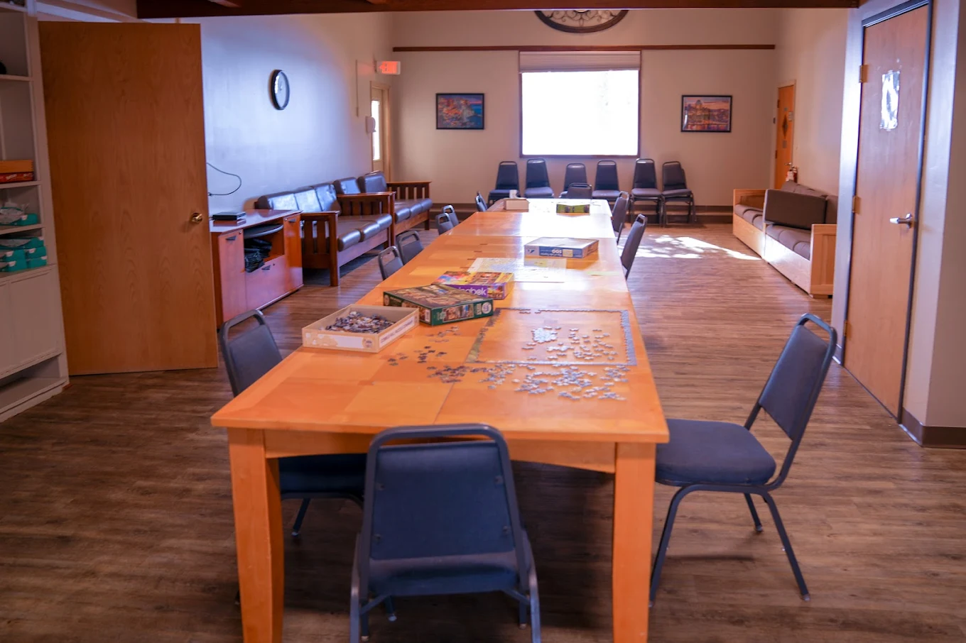 Recreational room with table, chairs, and board games