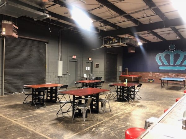Multipurpose activity room with tables and ping pong