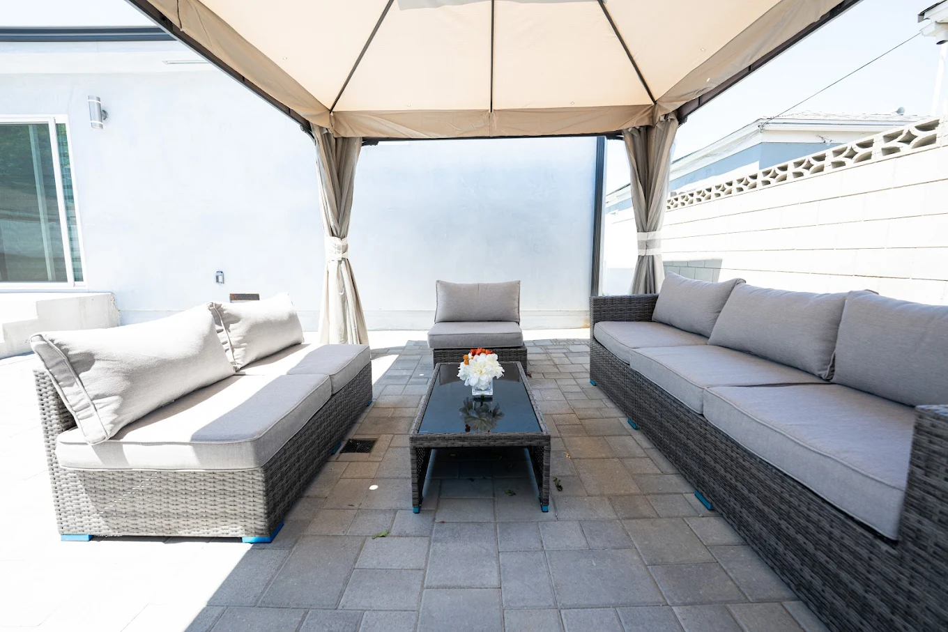 Covered patio with cushioned outdoor seating