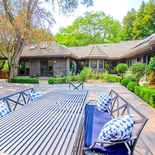 Outdoor deck with a table and seating.