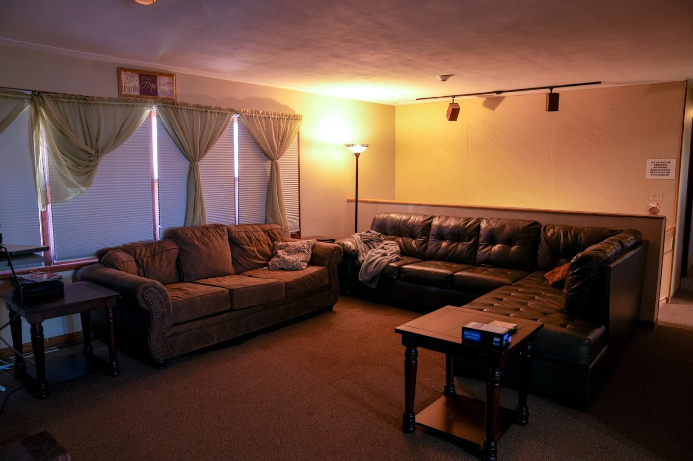 Cozy living room with sectional sofas and warm lighting