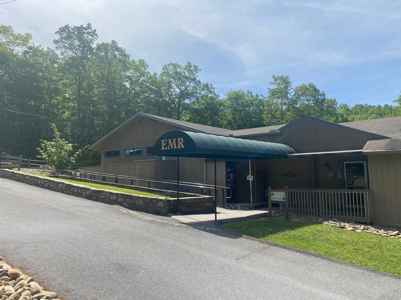 English Mountain Recovery building entrance with covered awning and accessible ramp