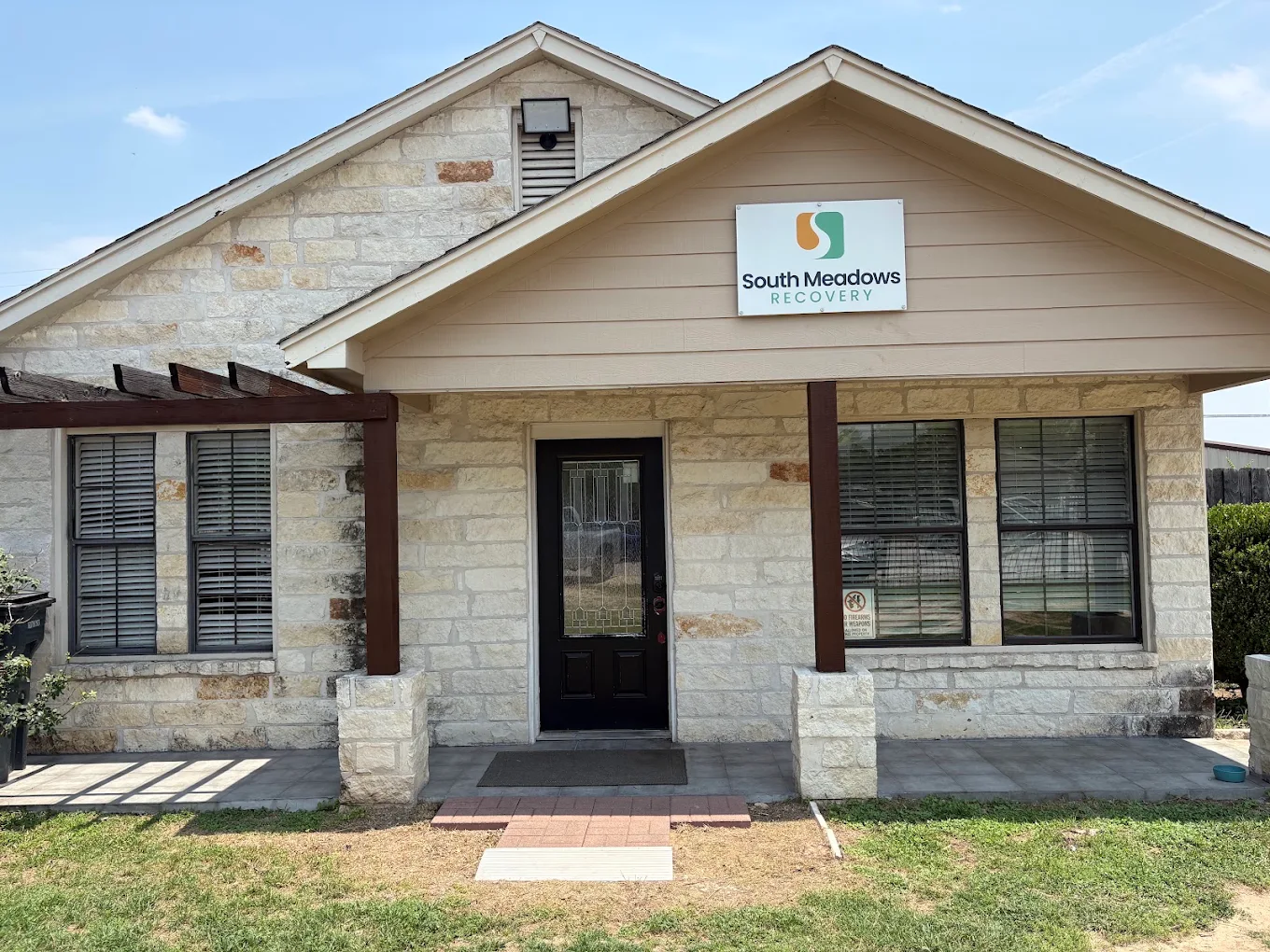 Stone facility exterior with South Meadows Recovery sign