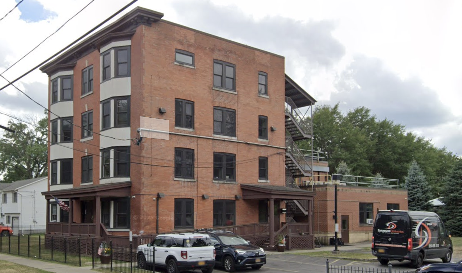 Brick rehab center with parking lot and exterior stairway