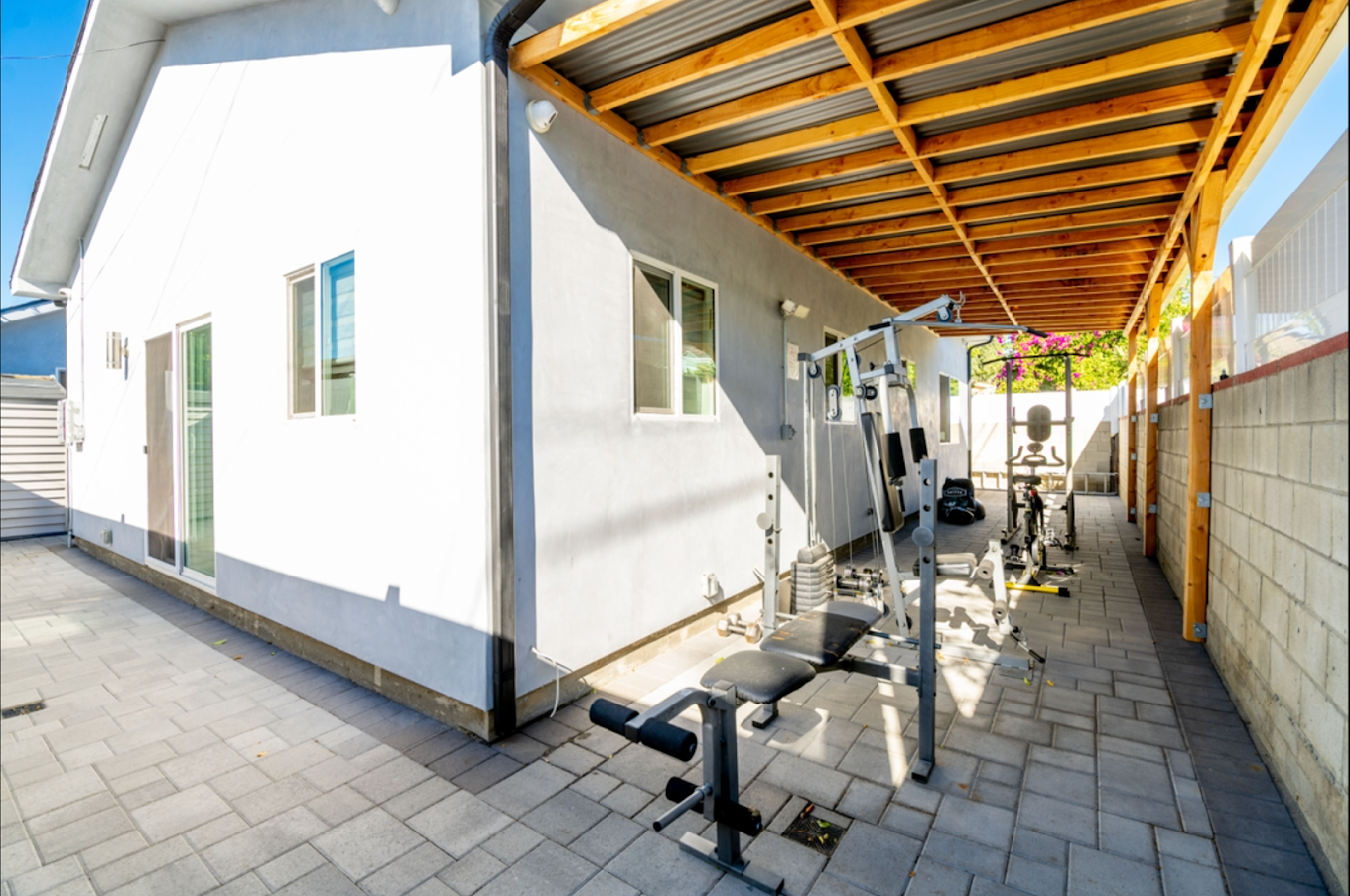 Covered outdoor gym with weight equipment