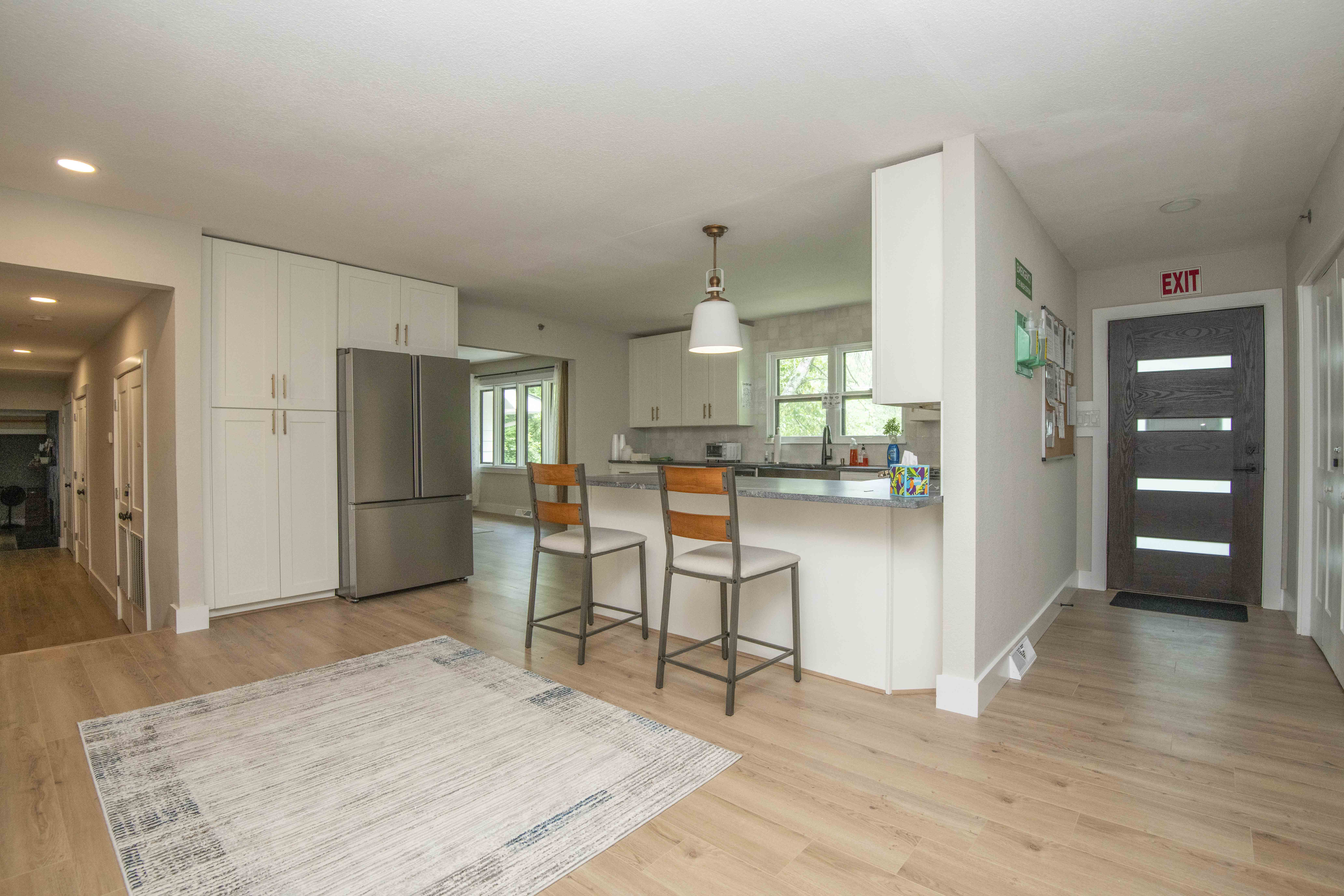 Modern kitchen with bar seating and stainless steel appliances