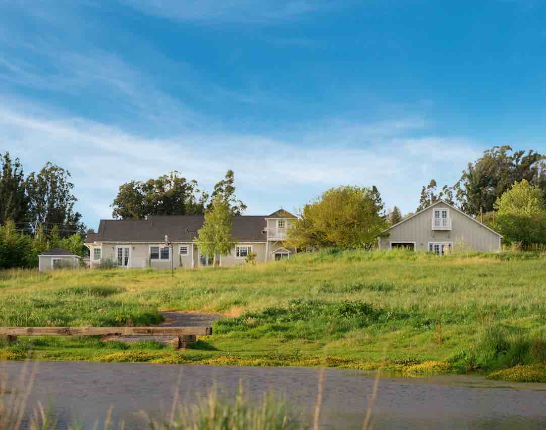 Street vew of facility with lawn.