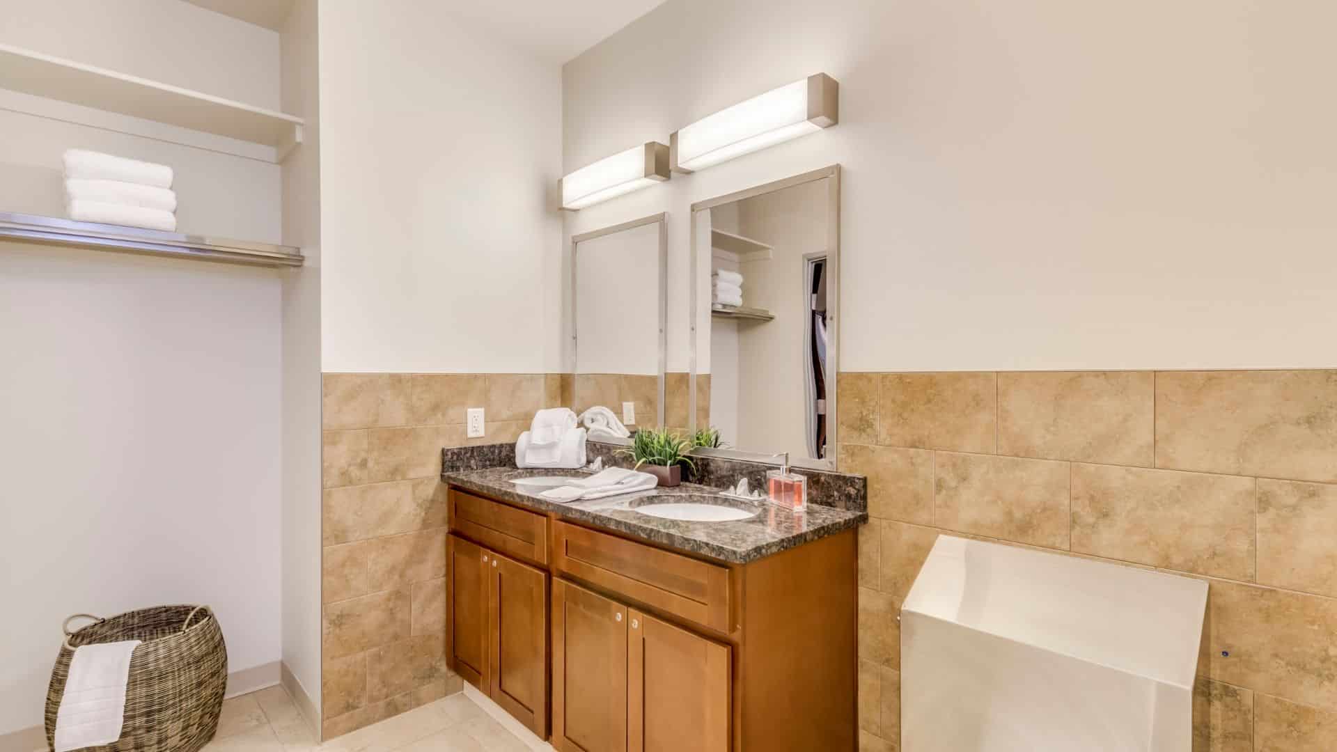 Bathroom with two sinks and mirrors.