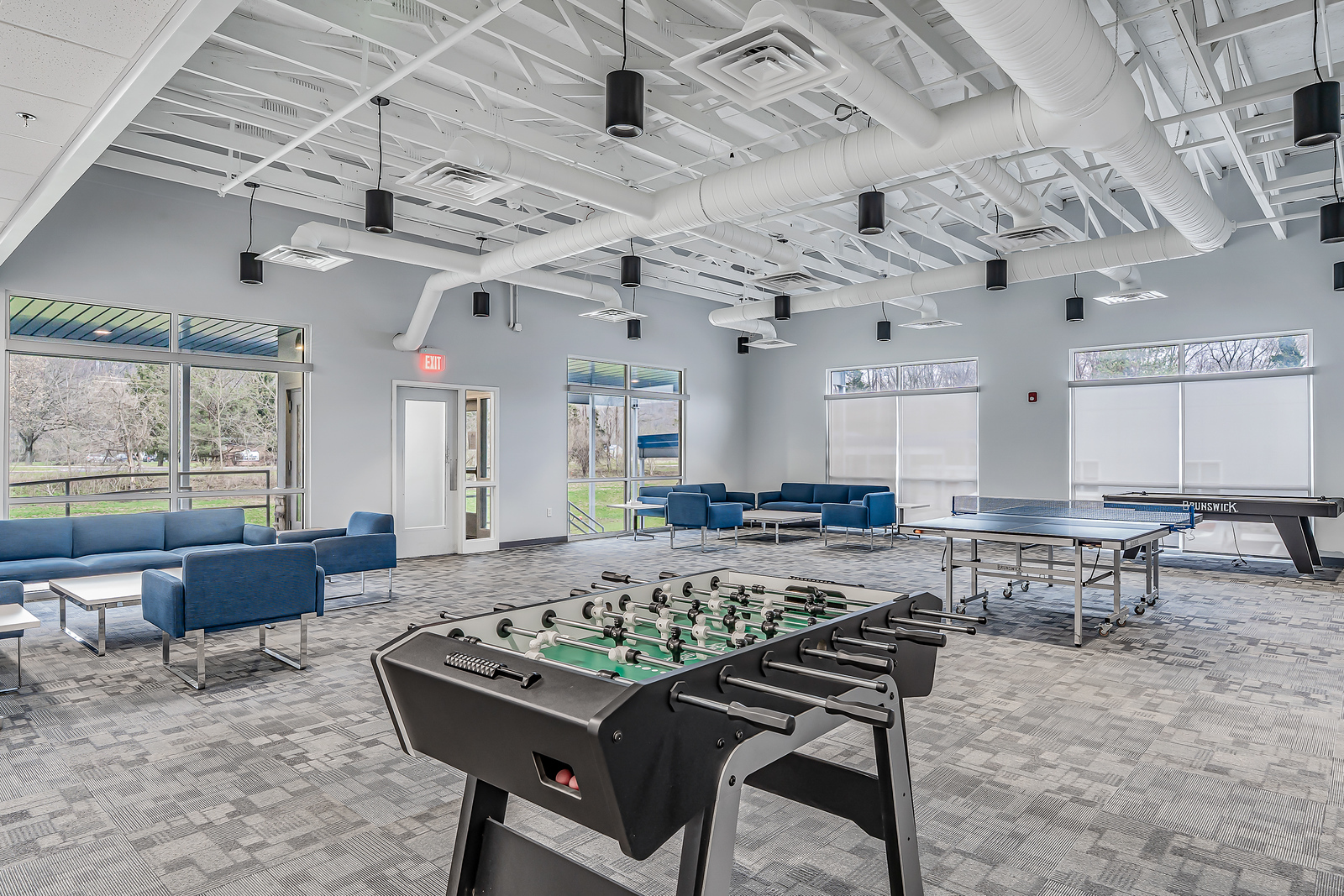 Spacious game room with foosball and seating