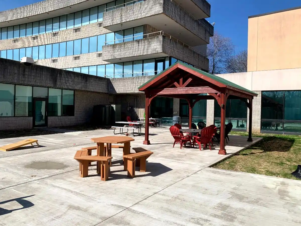 Courtyard with gazebo, picnic tables, and lounge chairs